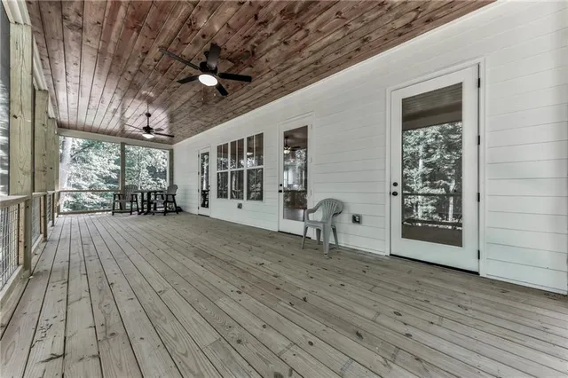 a spacious en suite bathroom with a double sink shower and mirror