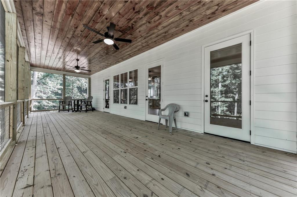 1560 Howell Bridge Road Ball Ground, GA 30107 - Photo 6 of 14 a view of a livingroom with wooden floor