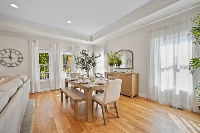 a dining room with furniture window wooden floor