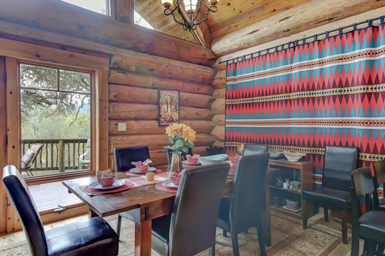 9844 Township Road Browns Valley, CA 95918 - Photo 13 of 35 a view of a dining room with furniture and a book shelf