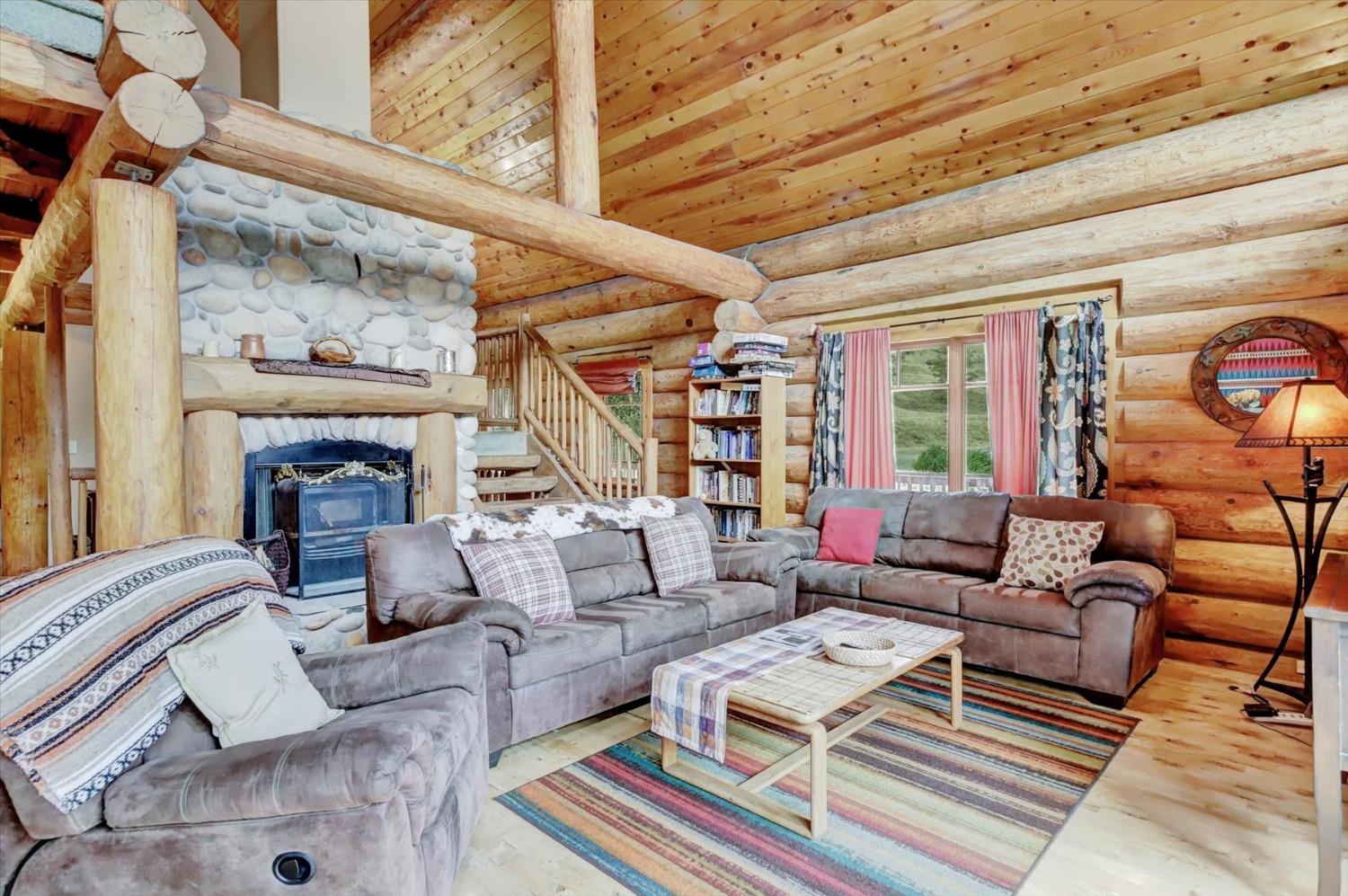 9844 Township Road Browns Valley, CA 95918 - Photo 14 of 35 a living room with furniture a fireplace and a large window