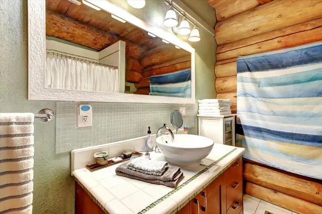 a balcony with furniture and a large window