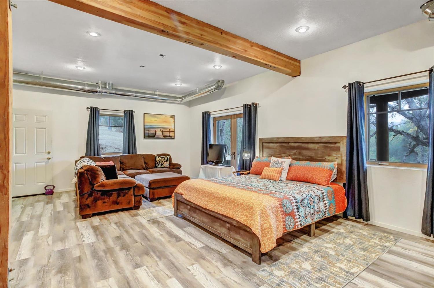 9844 Township Road Browns Valley, CA 95918 - Photo 24 of 35 a bedroom with a large bed and a couch