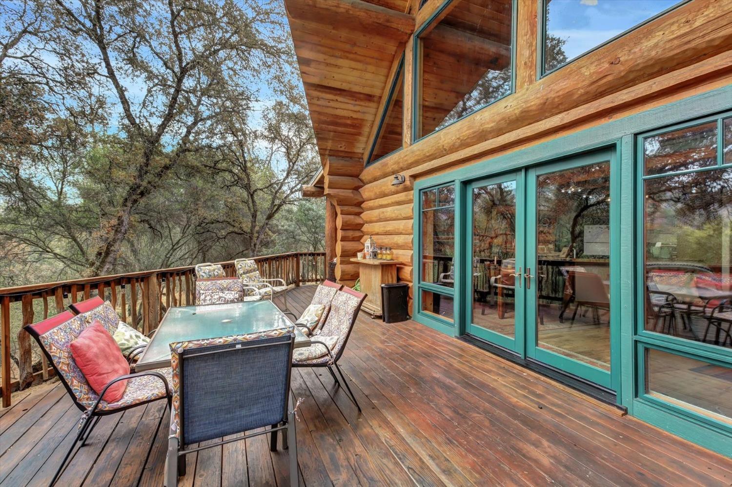 9844 Township Road Browns Valley, CA 95918 - Photo 29 of 35 a balcony with wooden floor table and chairs