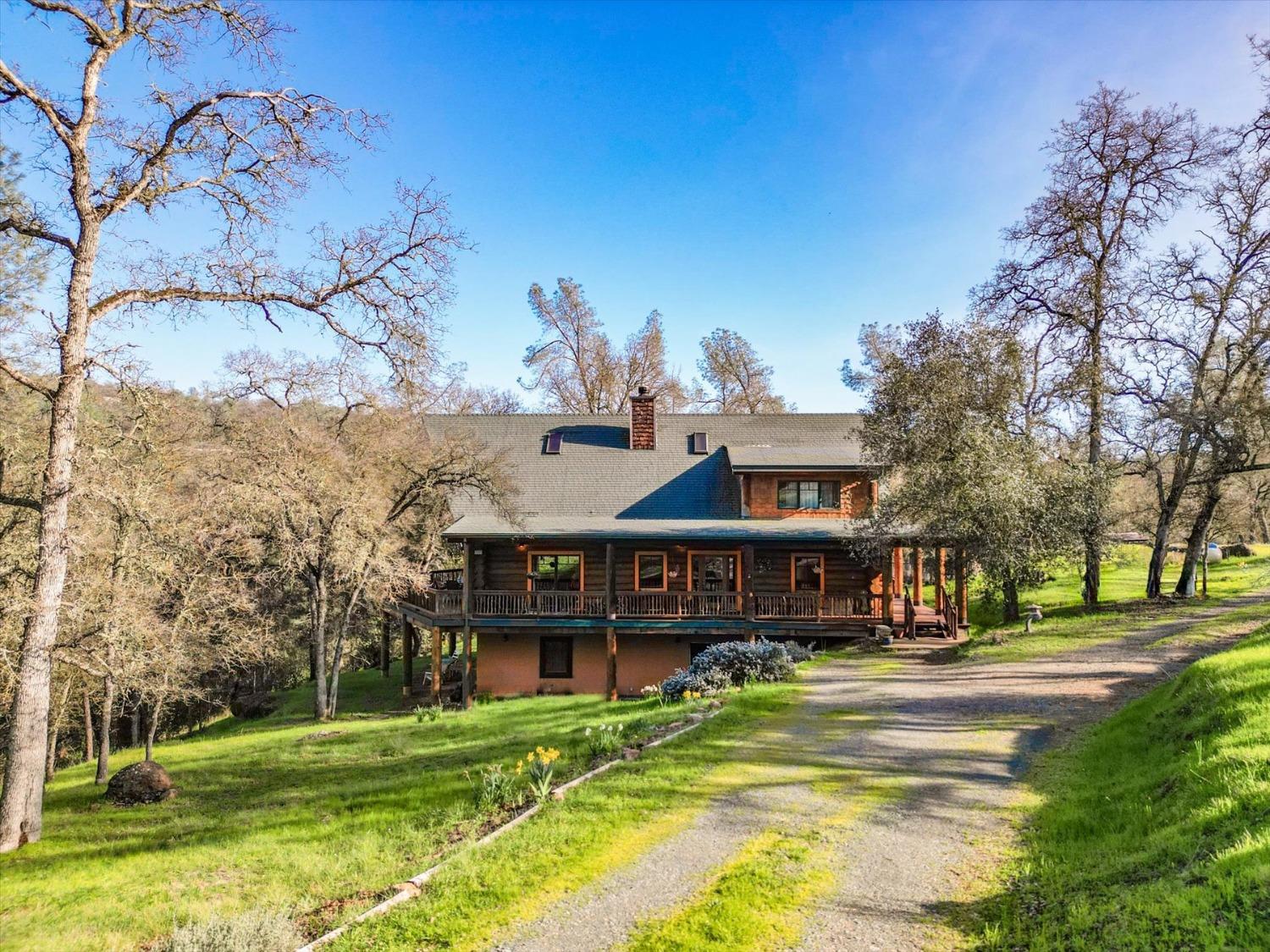 9844 Township Road Browns Valley, CA 95918 - Photo 3 of 35 a front view of a house with a yard table and chairs