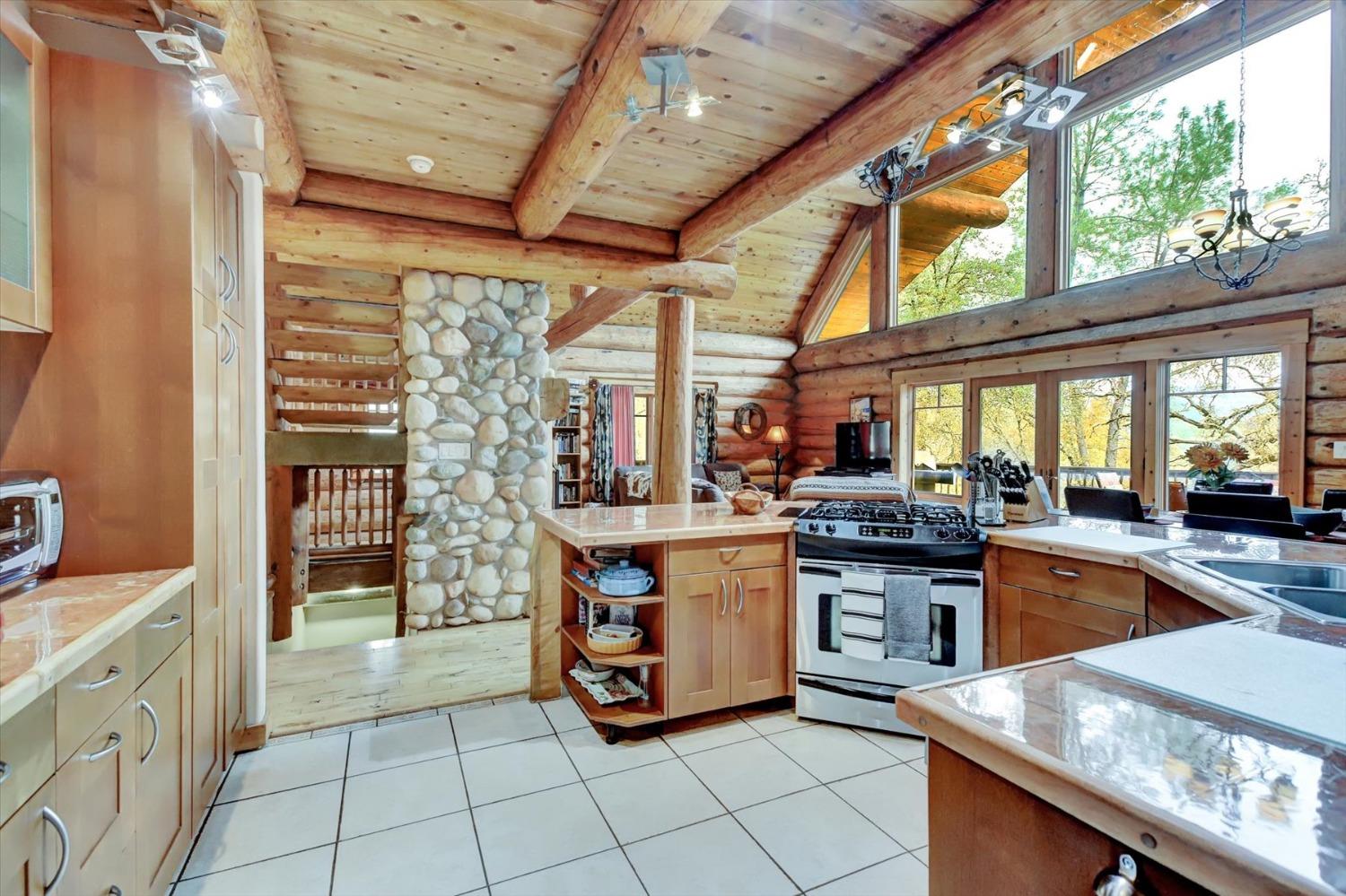 9844 Township Road Browns Valley, CA 95918 - Photo 4 of 35 a kitchen with stainless steel appliances granite countertop a stove a sink and a refrigerator