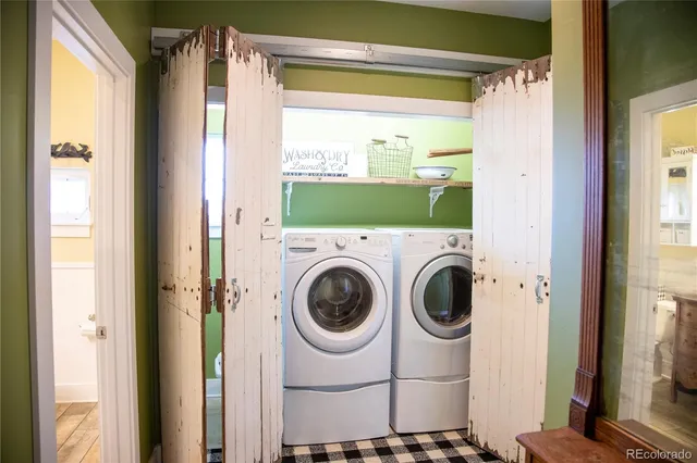 a view of a room that has a table and chairs in it