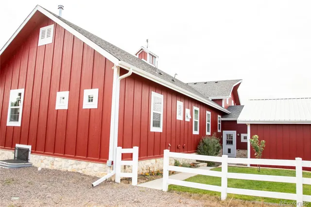 a view of a house with a small backyard
