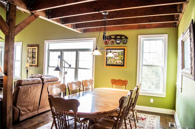 a view of a dining room with furniture a livingroom and furniture