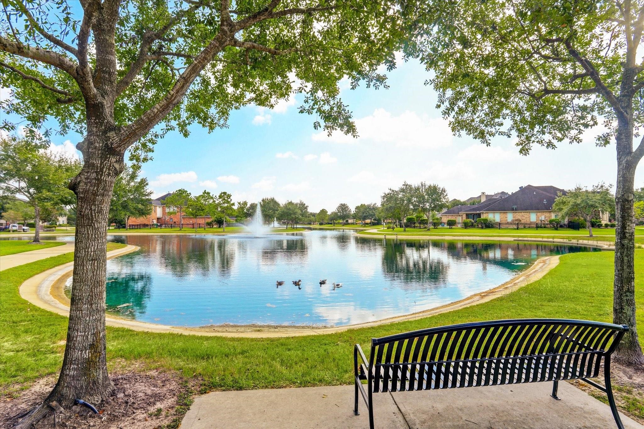 5718 Brennan Ridge Lane Katy, TX 77450 - Photo 40 of 42 TRANQUIL OUTDOOR SPACES: Stocked fishing lakes, mature trees, interconnected trails, and serene water views create the perfect setting for morning walks or evening relaxation.