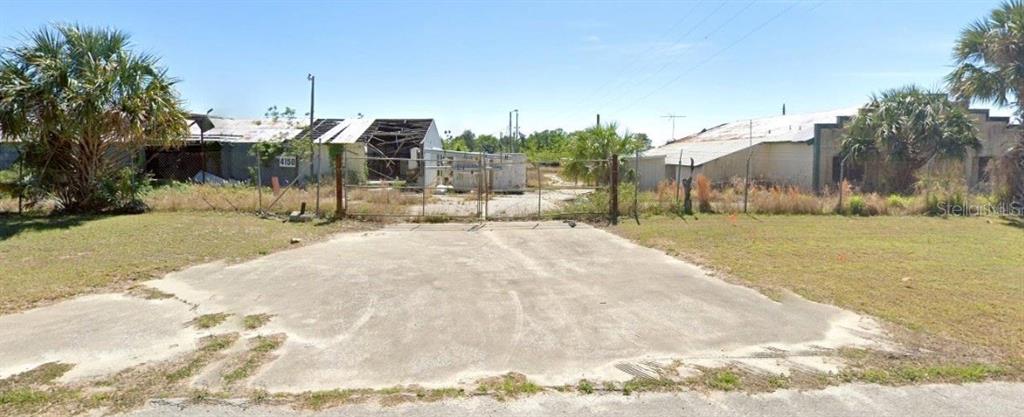 4212 Hogshead Road Apopka, FL 32712 - Photo 1 of 1 a view of a house with a yard covered with snow
