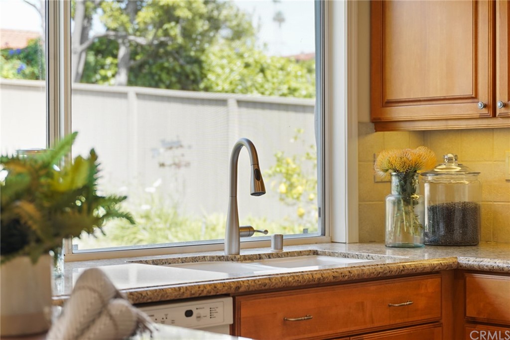 26623 Nokomis Road Rancho Palos Verdes, CA 90275 - Photo 16 of 42 a bathroom with a granite countertop sink and a large mirror next to a window