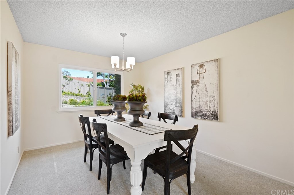 26623 Nokomis Road Rancho Palos Verdes, CA 90275 - Photo 9 of 42 a view of a dining room with furniture and chandelier
