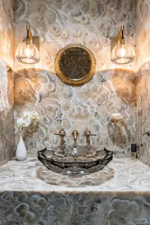 a kitchen with granite countertop a stove a sink and a microwave