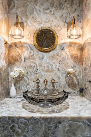 a kitchen with granite countertop a stove a sink and a microwave