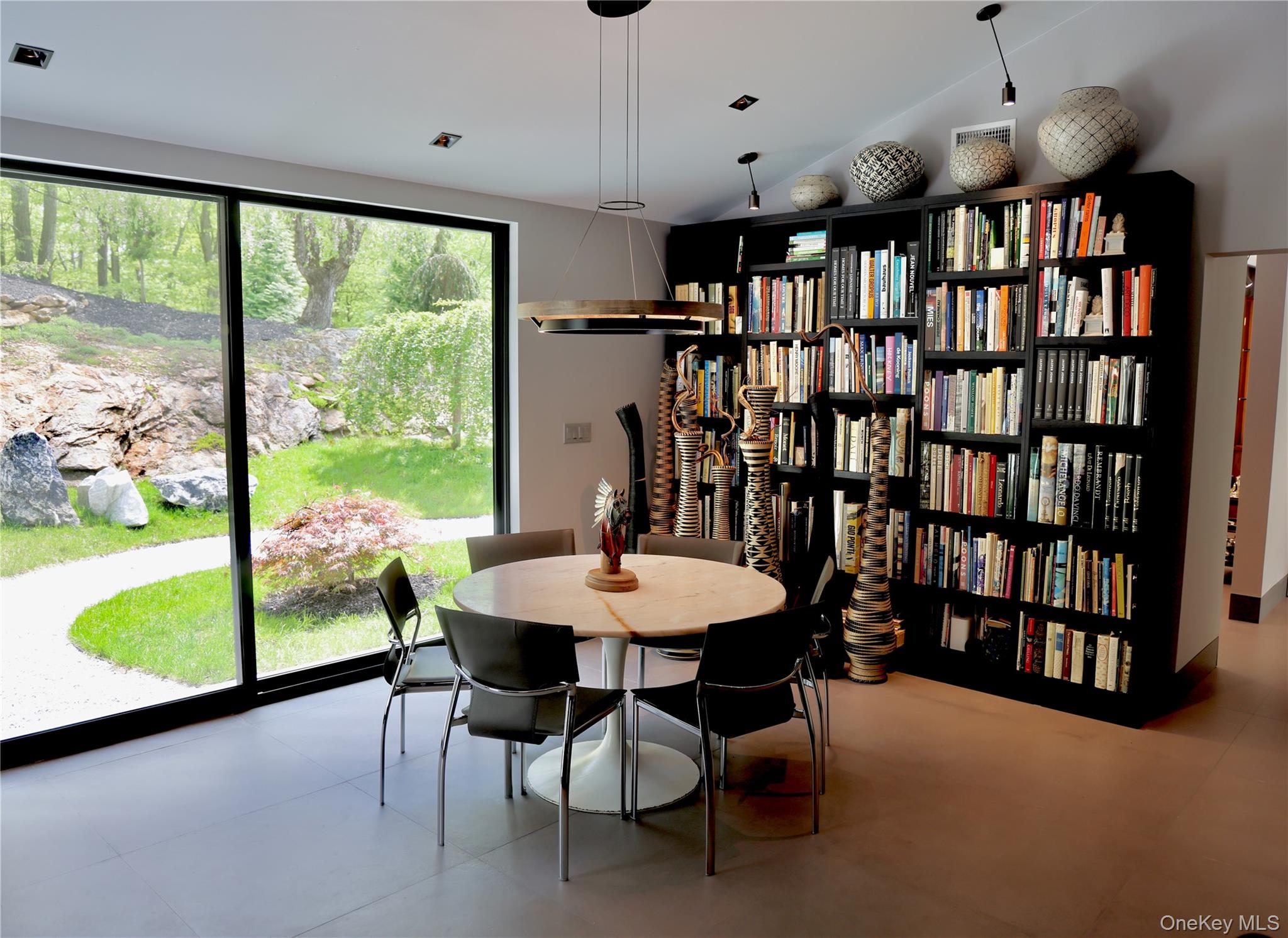 49 Indian Hill Road Pound Ridge, NY 10576 - Photo 16 of 34 a view of a dining room with furniture window and outside view