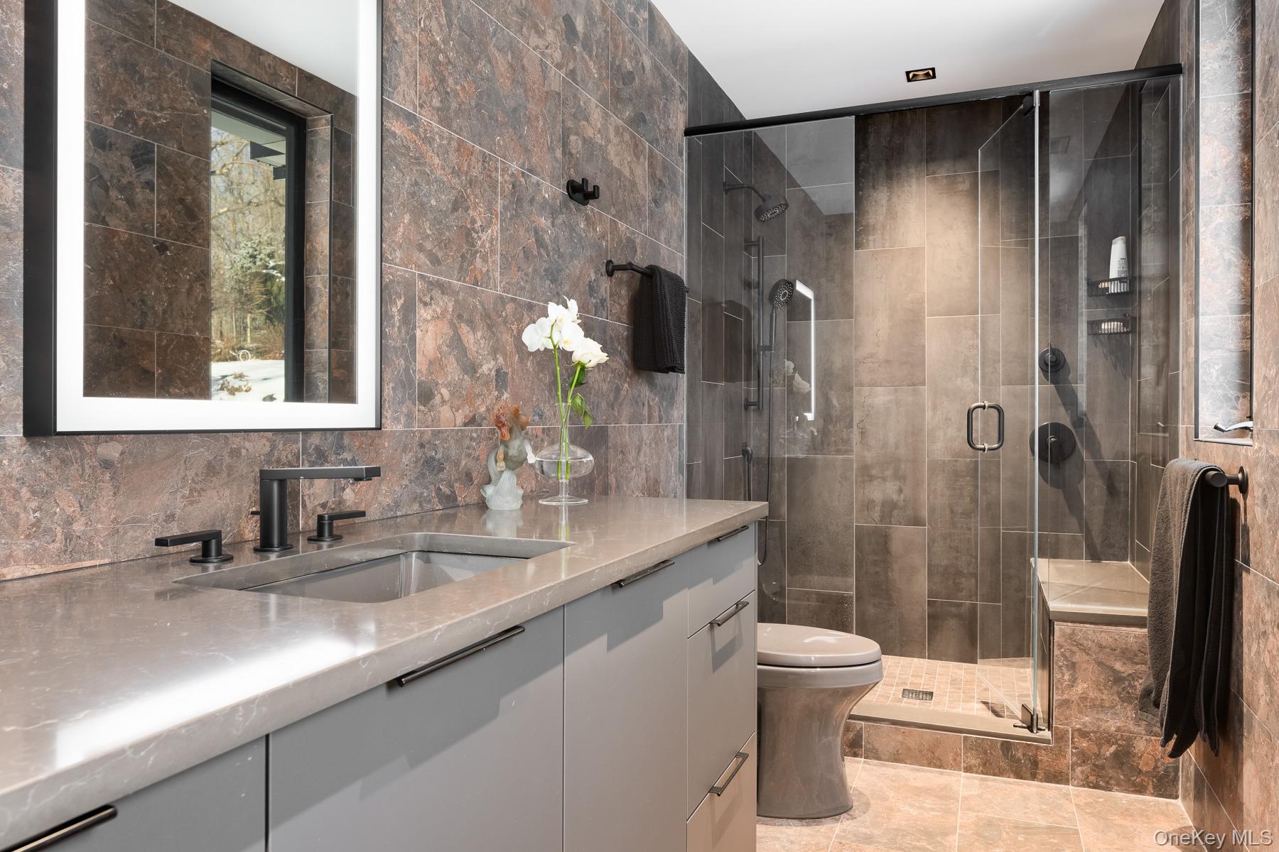 49 Indian Hill Road Pound Ridge, NY 10576 - Photo 18 of 34 a bathroom with a sink a toilet and shower