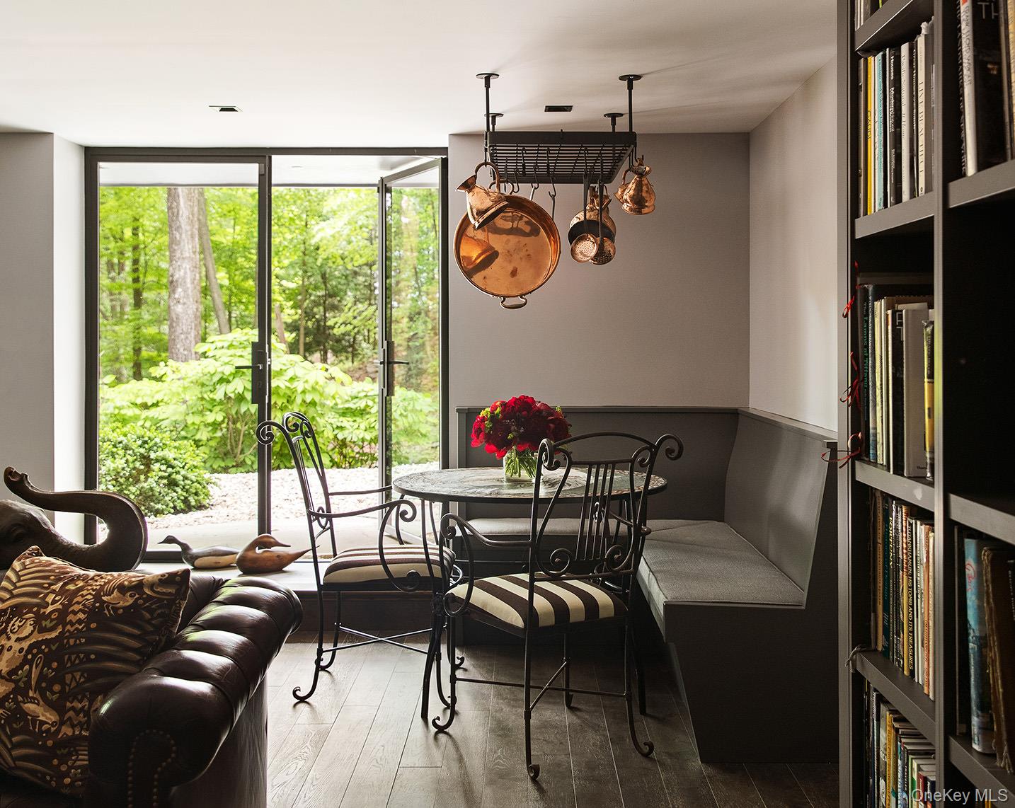 49 Indian Hill Road Pound Ridge, NY 10576 - Photo 21 of 34 Dining area featuring expansive windows and wood finished floors
