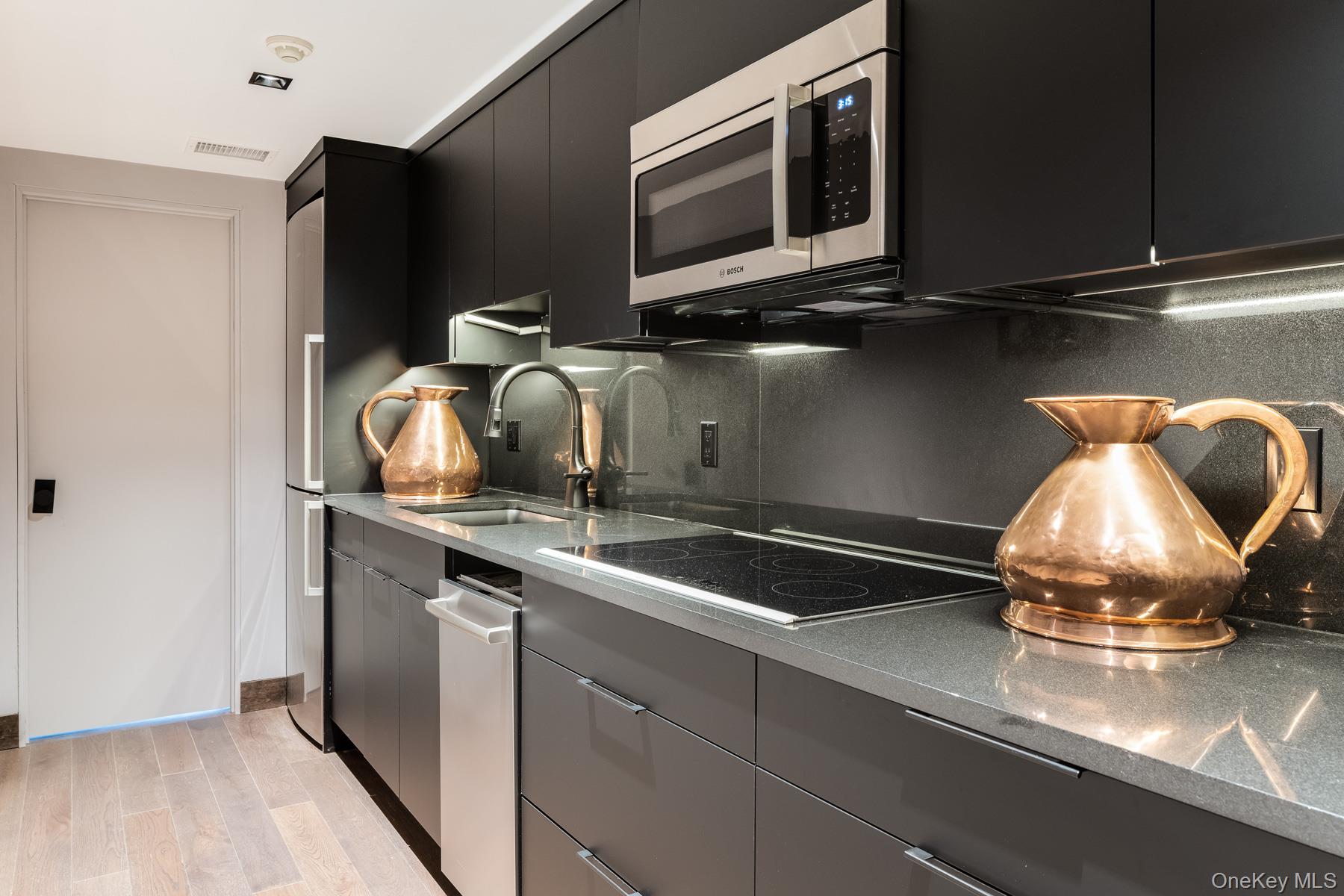 49 Indian Hill Road Pound Ridge, NY 10576 - Photo 22 of 34 a kitchen with a sink and cabinets