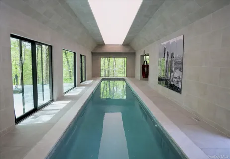a view of swimming pool with a balcony