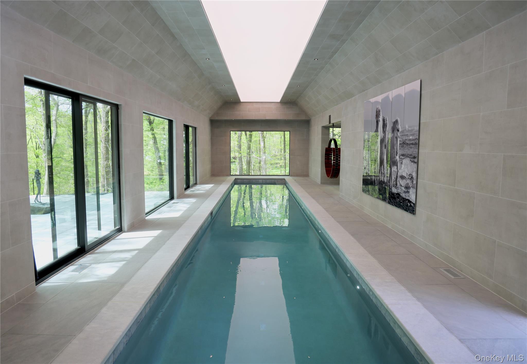 49 Indian Hill Road Pound Ridge, NY 10576 - Photo 3 of 34 a view of a living room and window