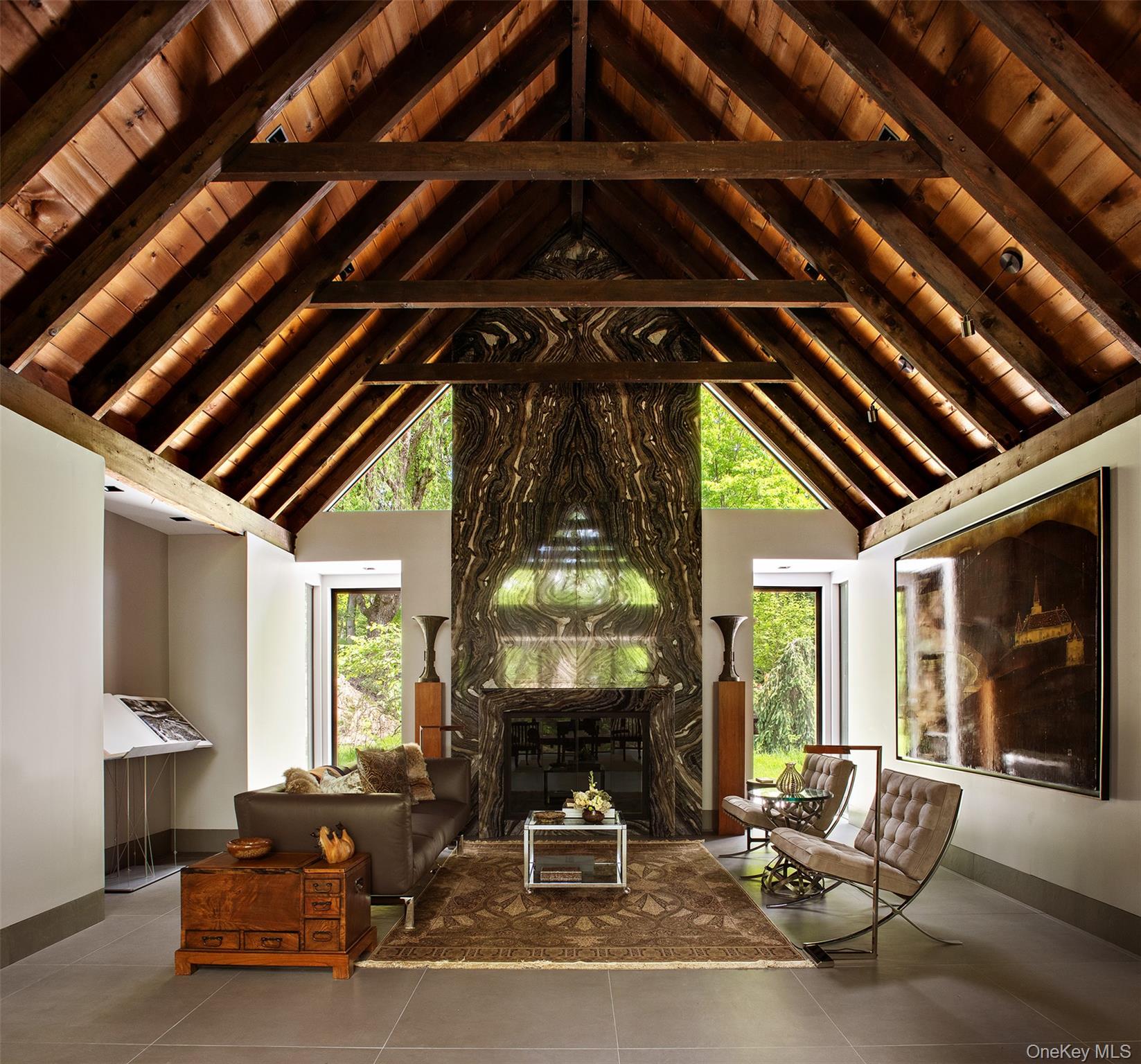 49 Indian Hill Road Pound Ridge, NY 10576 - Photo 8 of 34 a living room with furniture and a large window