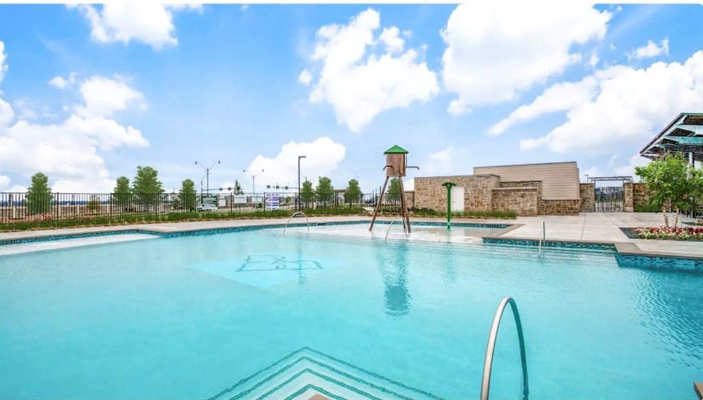 406 Madrone Lane Princeton, TX 75407 - Photo 28 of 30 Resort-style swimming pool featuring a water play structure, integrated steps, and a surrounding paved deck