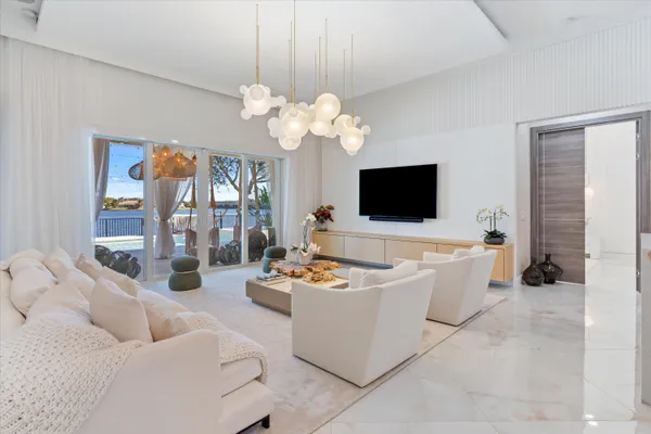 a living room with furniture fireplace and a flat screen tv