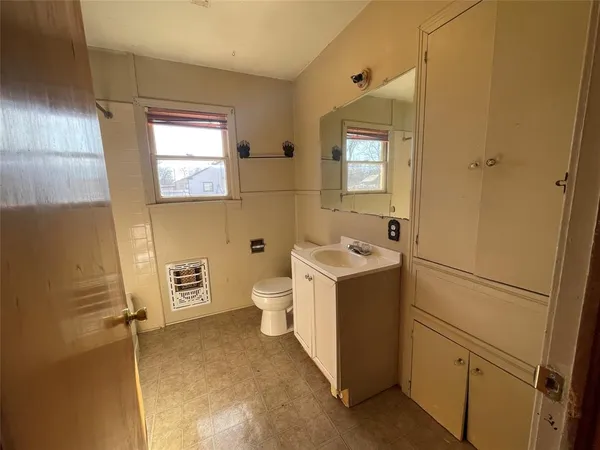 a bathroom with a sink and mirror