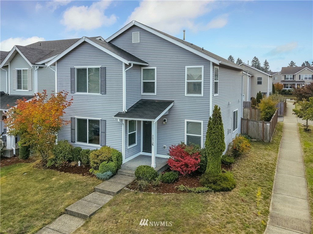 3075 Walker Road DuPont, WA 98327 - Photo 1 of 27 a front view of house with yard and trees around