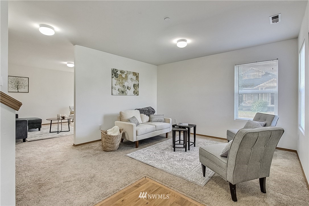 3075 Walker Road DuPont, WA 98327 - Photo 3 of 27 a living room with furniture and a window