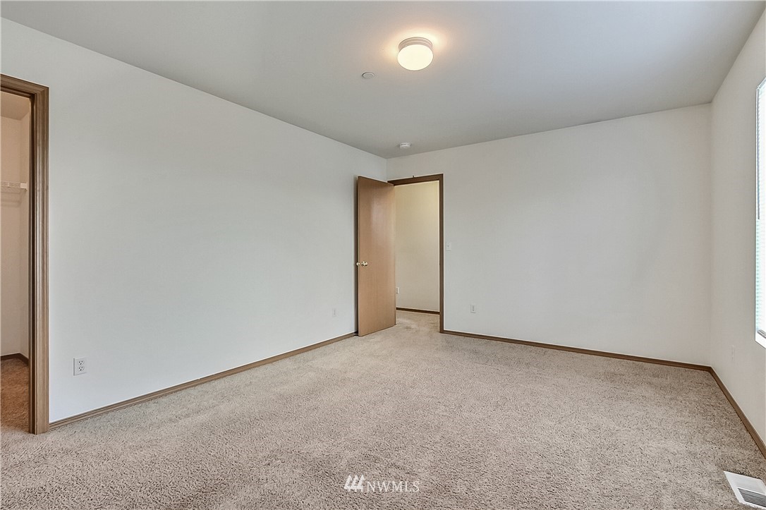 3075 Walker Road DuPont, WA 98327 - Photo 22 of 27 an empty room with a natural light