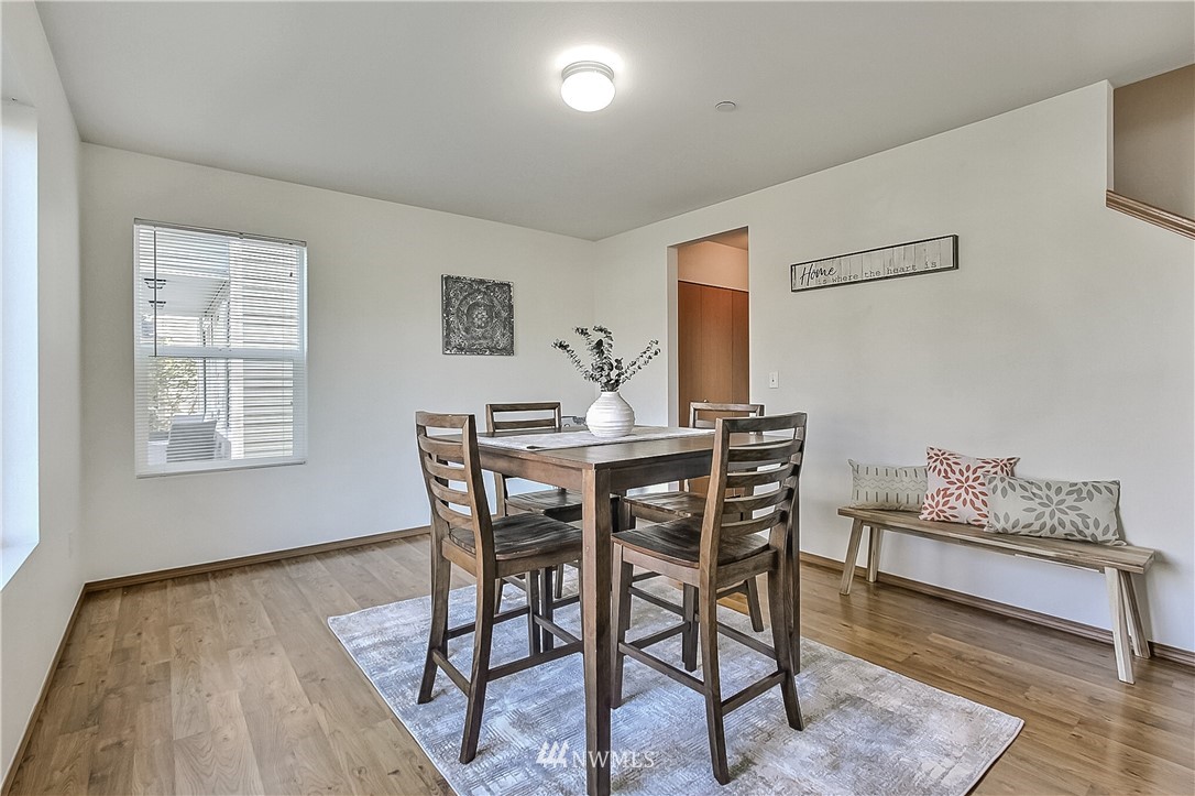 3075 Walker Road DuPont, WA 98327 - Photo 5 of 27 a dining room with furniture and wooden floor