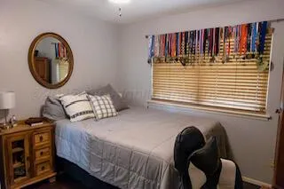 a bedroom with a bed and a closet