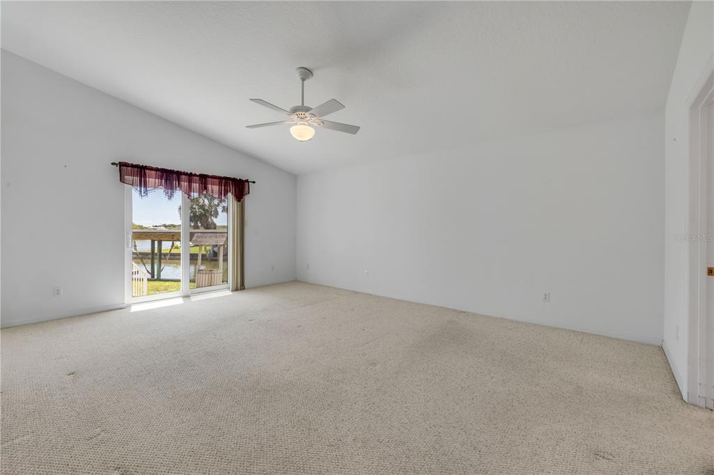 192 Azalea Road Edgewater, FL 32141 - Photo 23 of 94 a view of an empty room with a window