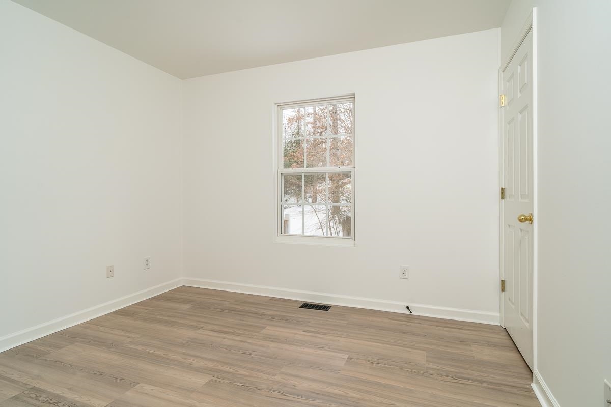 37 Hatchechubee Road Palmyra, VA 22963 - Photo 13 of 27 an empty room with wooden floor and windows