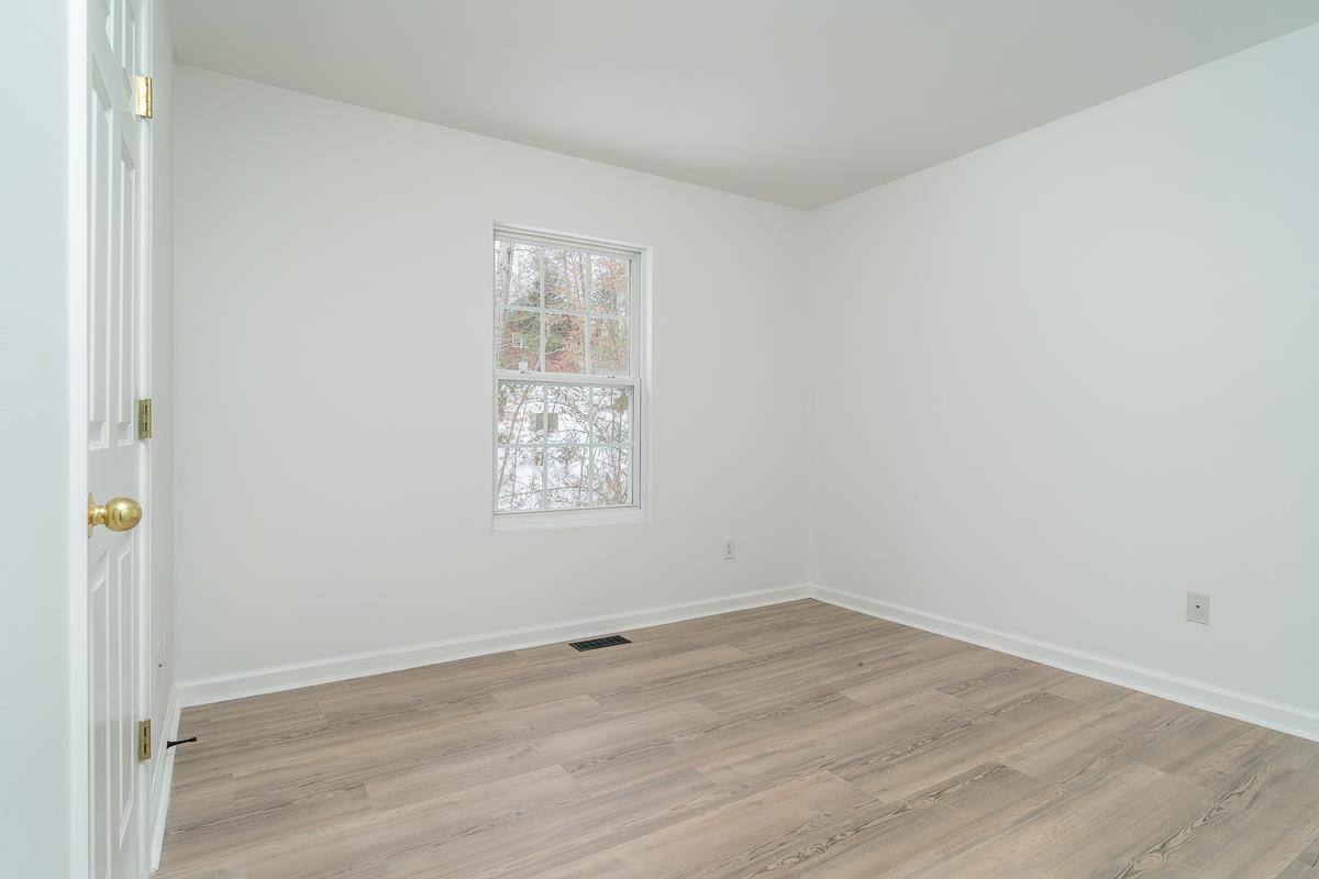 37 Hatchechubee Road Palmyra, VA 22963 - Photo 14 of 27 an empty room with wooden floor and window
