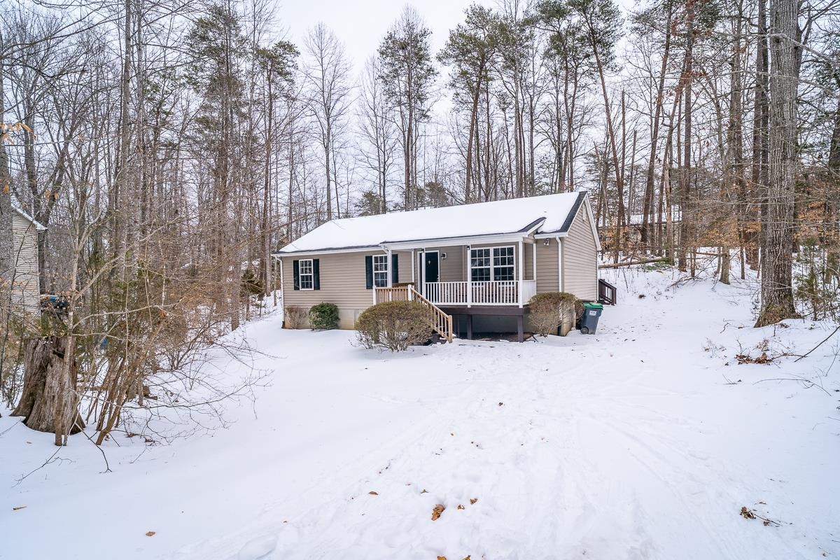 37 Hatchechubee Road Palmyra, VA 22963 - Photo 21 of 27 a view of a house with a yard covered in snow