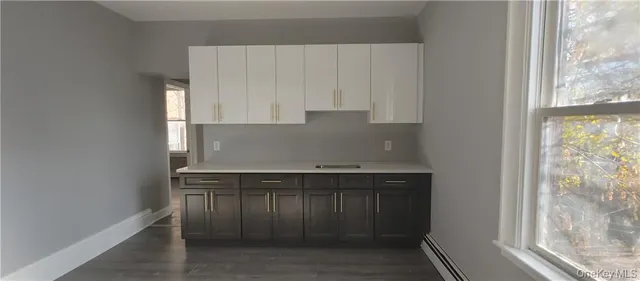 a kitchen with a sink and cabinets