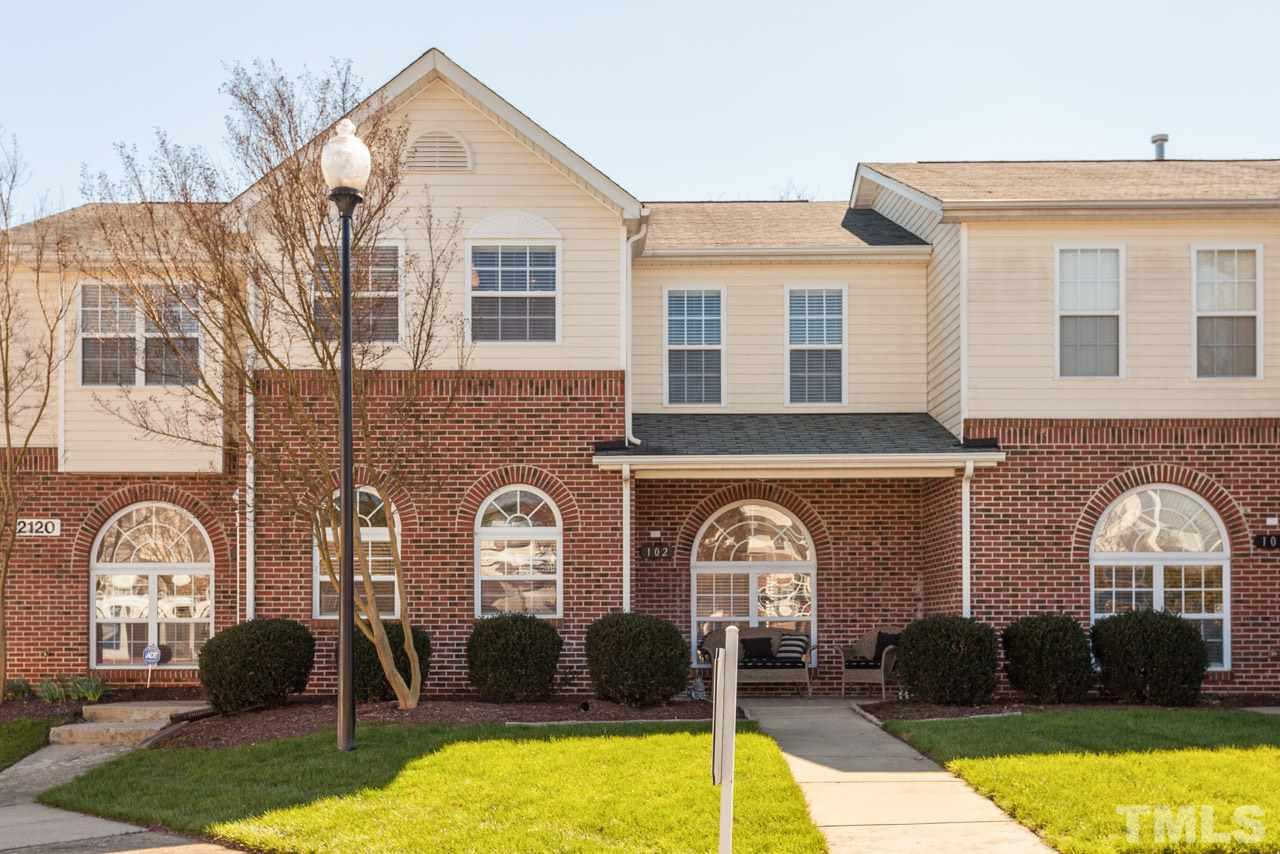 2120 Piney Brook Road, Unit 102 Raleigh, NC 27614 - Photo 1 of 24 a front view of a house with a yard