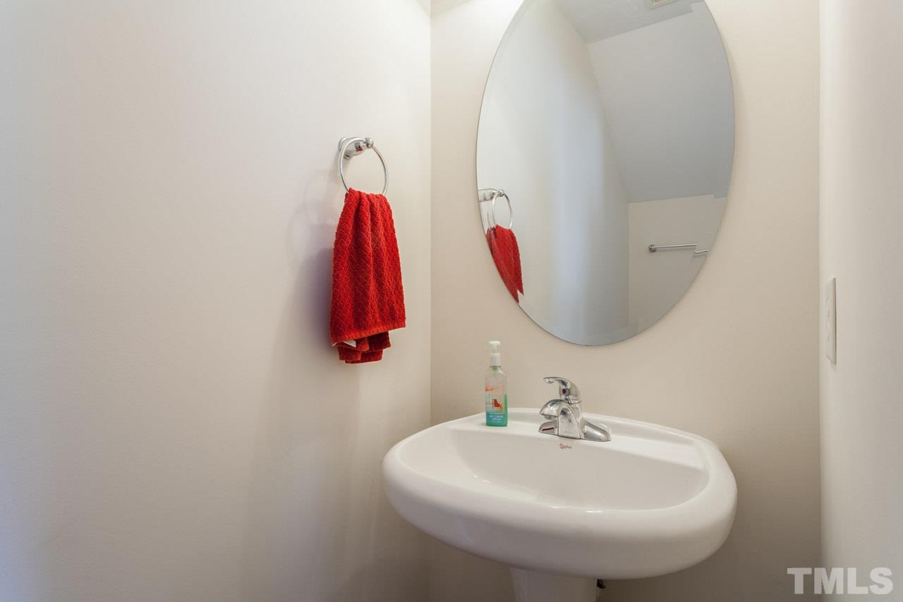 2120 Piney Brook Road, Unit 102 Raleigh, NC 27614 - Photo 14 of 24 a bathroom with a sink and a mirror