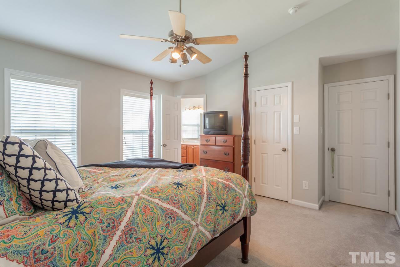 2120 Piney Brook Road, Unit 102 Raleigh, NC 27614 - Photo 16 of 24 a bedroom with a bed and window