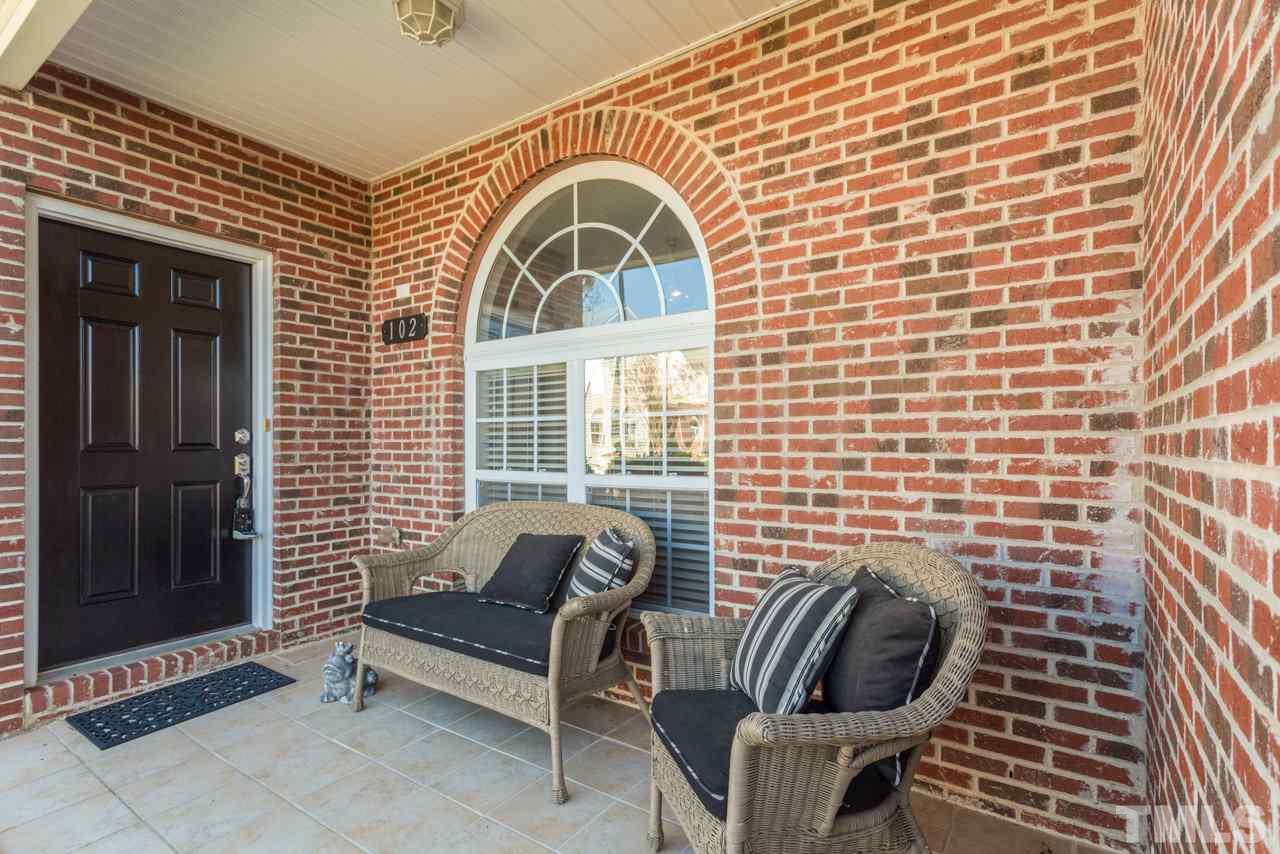 2120 Piney Brook Road, Unit 102 Raleigh, NC 27614 - Photo 3 of 24 a view of a brick house with outdoor space