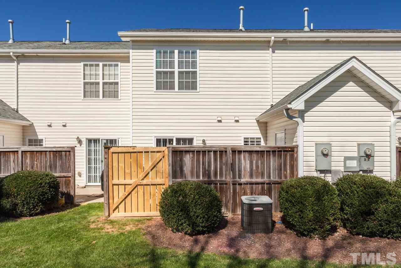 2120 Piney Brook Road, Unit 102 Raleigh, NC 27614 - Photo 24 of 24 a view of a small house with a garden