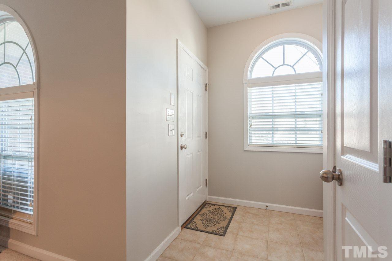 2120 Piney Brook Road, Unit 102 Raleigh, NC 27614 - Photo 4 of 24 a view of an empty room with a window