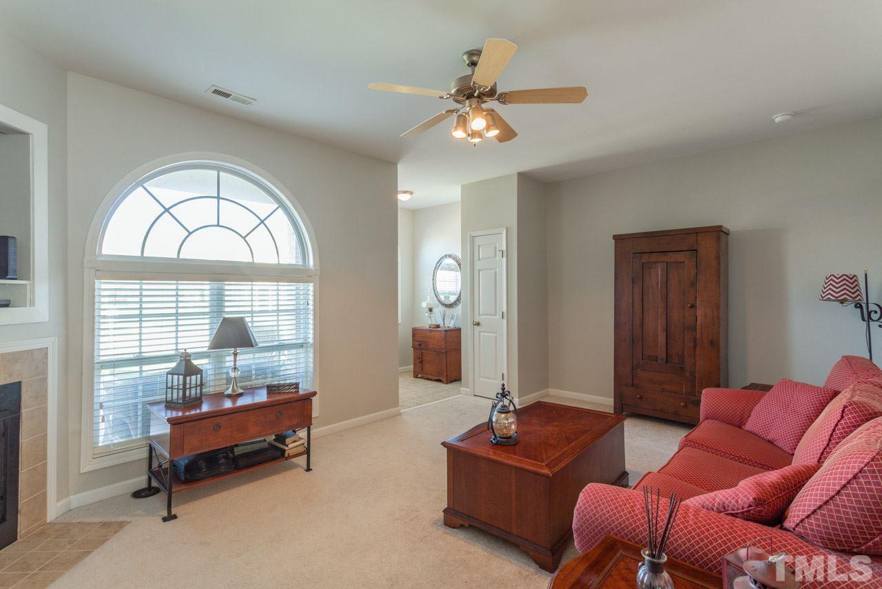 2120 Piney Brook Road, Unit 102 Raleigh, NC 27614 - Photo 5 of 24 a living room with furniture and a large window