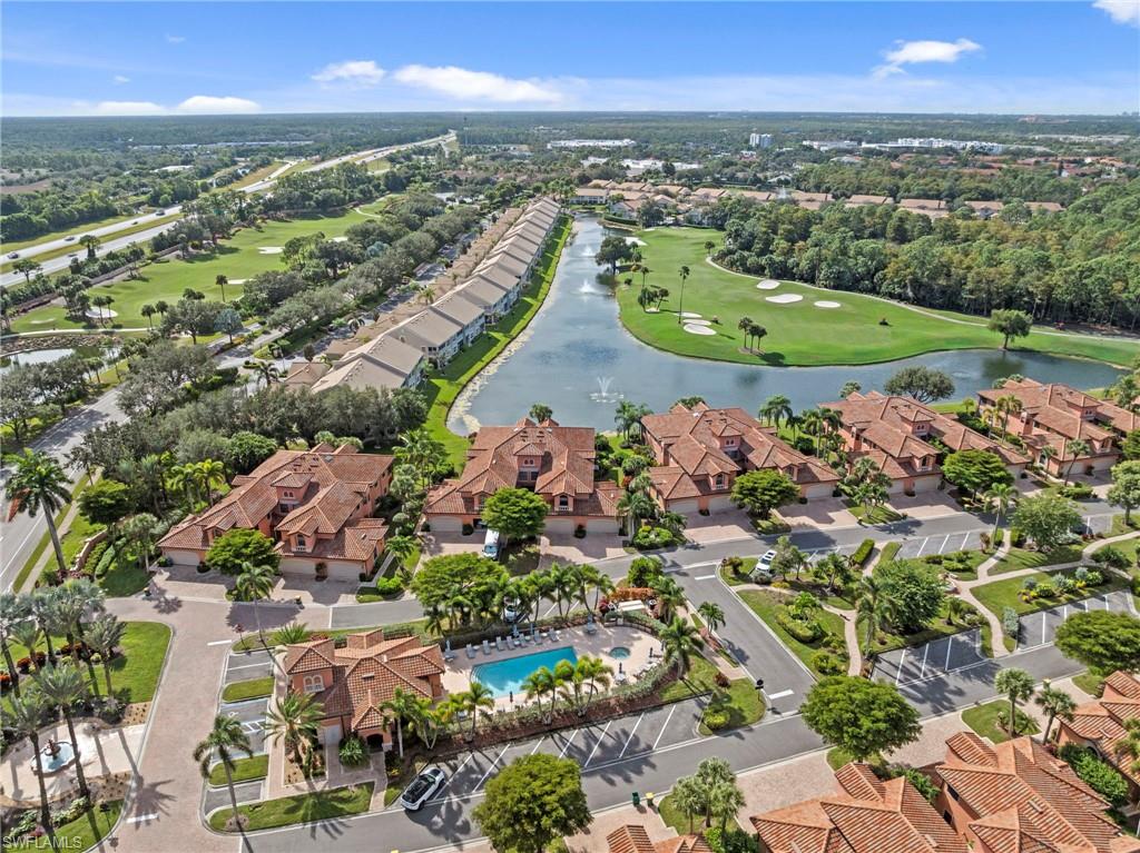 5720 Grande Reserve Way, Unit 2004 Naples, FL 34110 - Photo 21 of 27 an aerial view of a city and mountain view in back