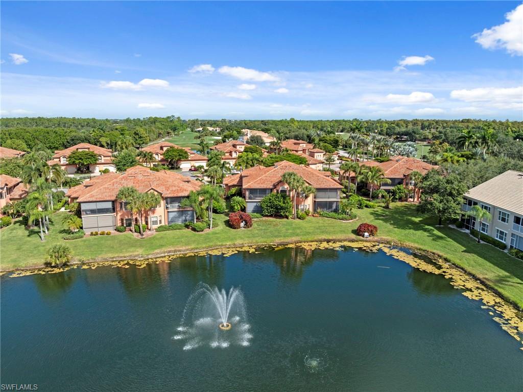 5720 Grande Reserve Way, Unit 2004 Naples, FL 34110 - Photo 22 of 27 a view of a lake with a city