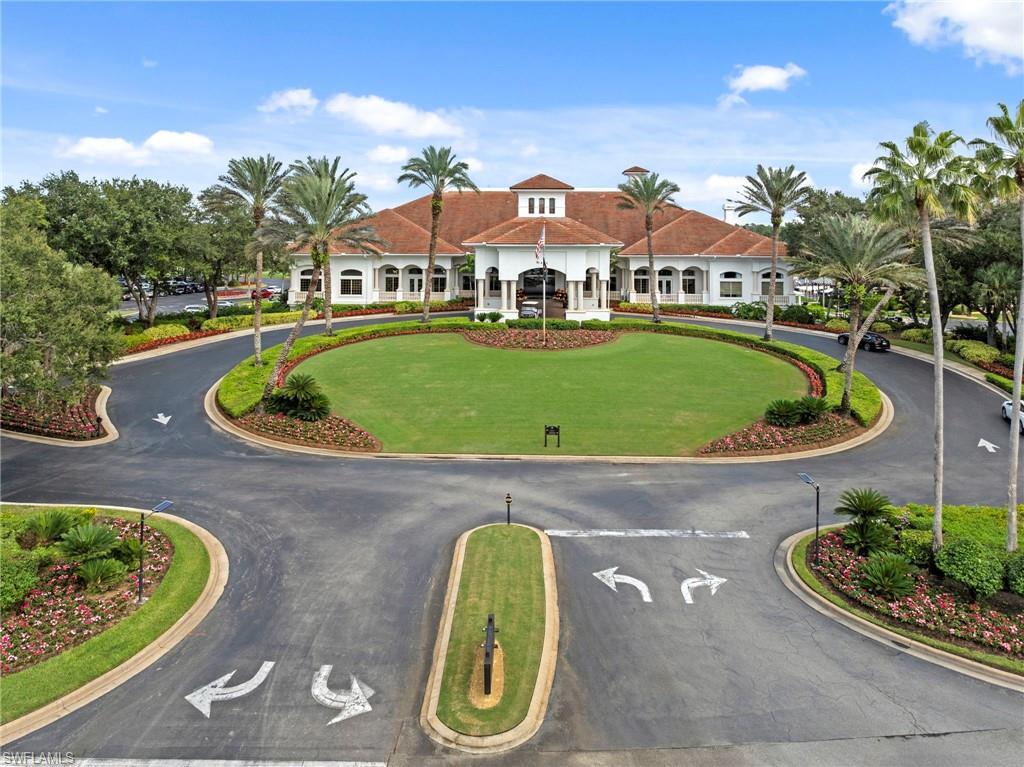 5720 Grande Reserve Way, Unit 2004 Naples, FL 34110 - Photo 24 of 27 a aerial view of a house with a garden and lake view