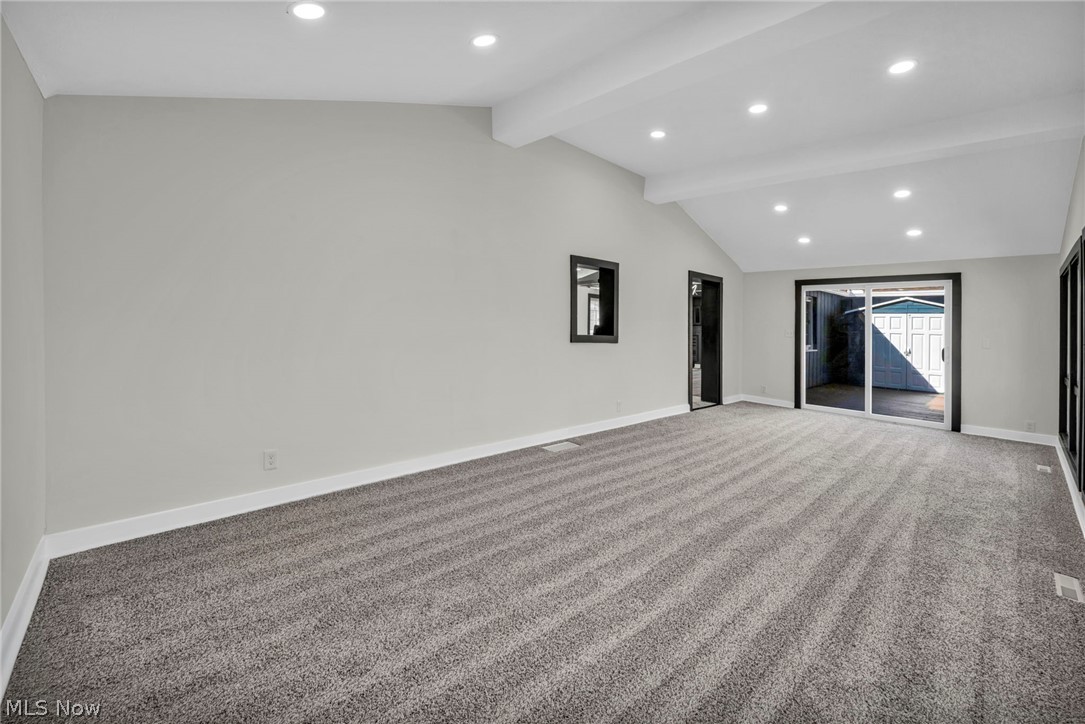 7339 River Road Olmsted Falls, OH 44138 - Photo 20 of 45 Vaulted ceiling room with recessed lighting and gray carpeting